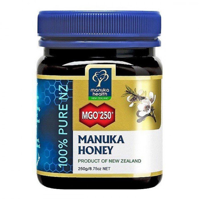 plastic jar with blue top and gold, white, and blue label of manuka honey